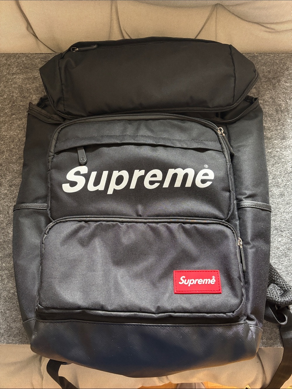 Supreme Black Backpack with White Logo and Red Patch